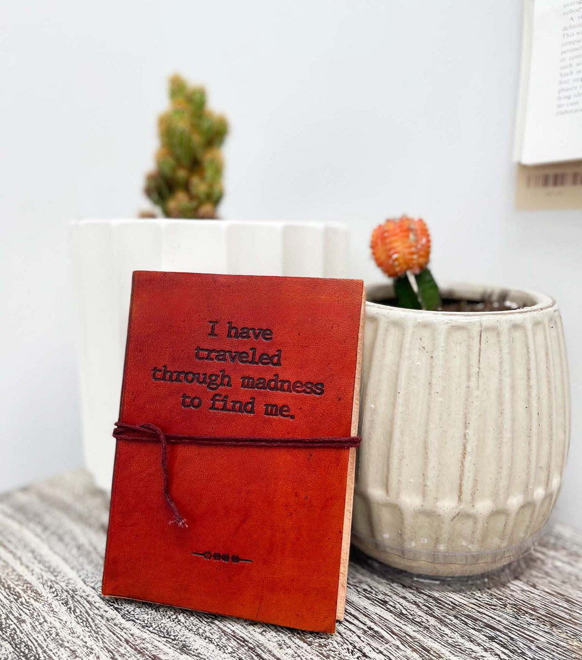 Madness Quote Leather Journal